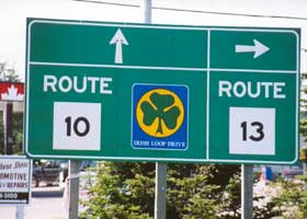 Sign at junction of routes 10 and 13, with small Irish Loop marker for route 10